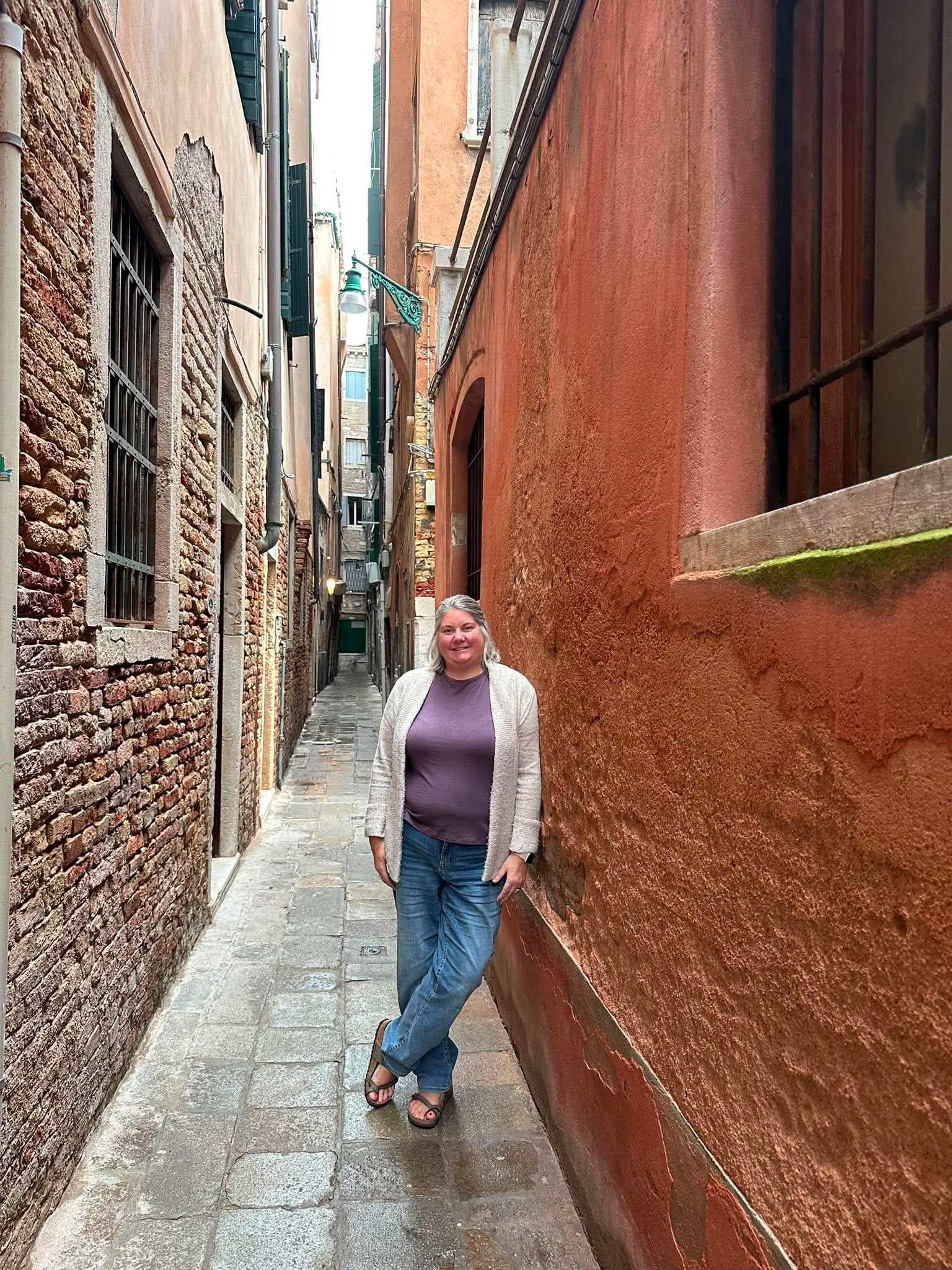 Heather exploring a charming Venice alleyway